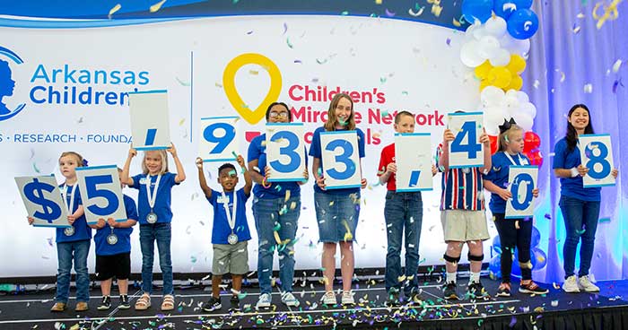 Children holding number signs.